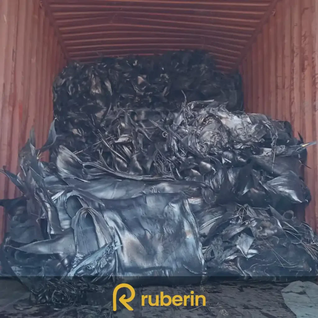 Nylon friction rubber scrap containing textile fibers, suitable for material recovery and rubber processing.
