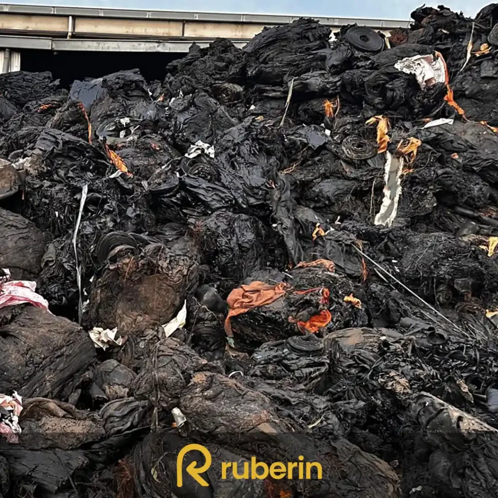 Tire cord fabric scrap with embedded textile fibers, extracted from used tires for rubber compound manufacturing.