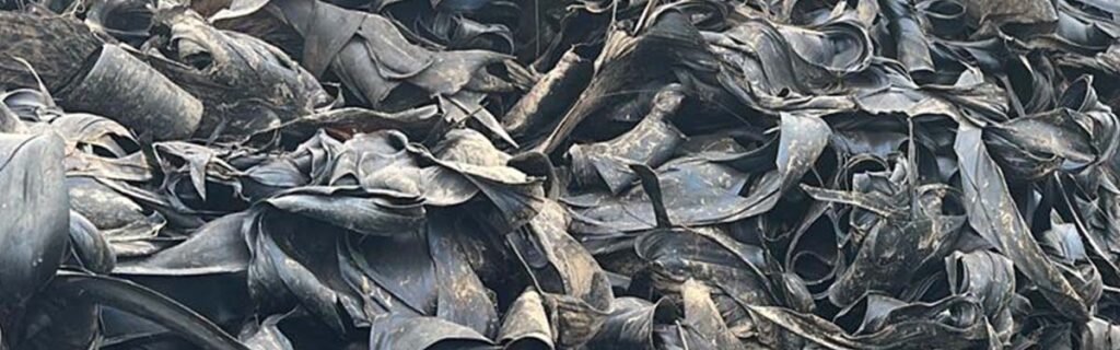 Steel friction scrap with visible rubber and exposed steel wires, used in industrial recycling and energy recovery
